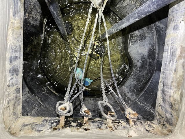 View into the damaged underground sump tank during confined-space repair work