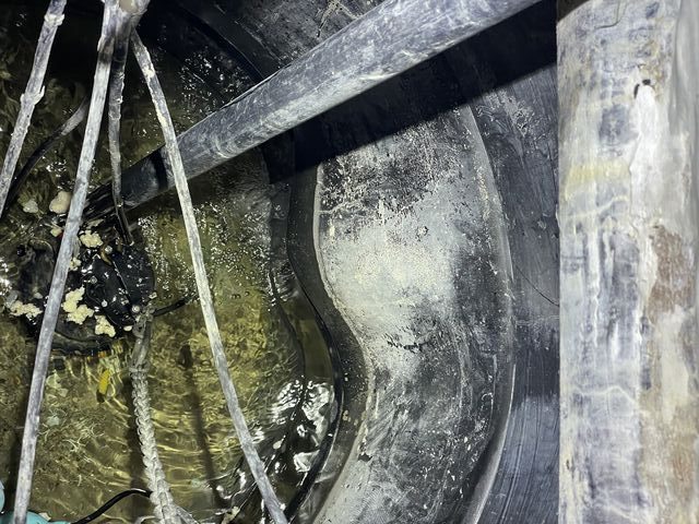 Deformed internal wall of the partially collapsed underground sump tank